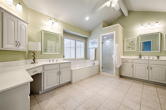 2215 Burgundy Dr, Carrollton, TX 75006 - bathroom with lofted ceiling with beams, a sink, a ceiling fan, two vanities, and a stall shower