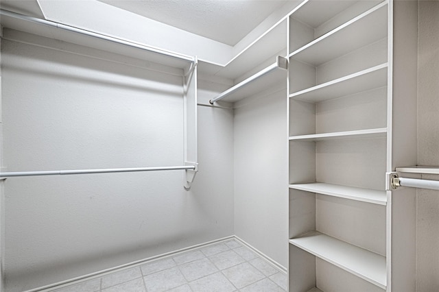 2215 Burgundy Dr, Carrollton, TX 75006 - spacious closet featuring tile patterned floors