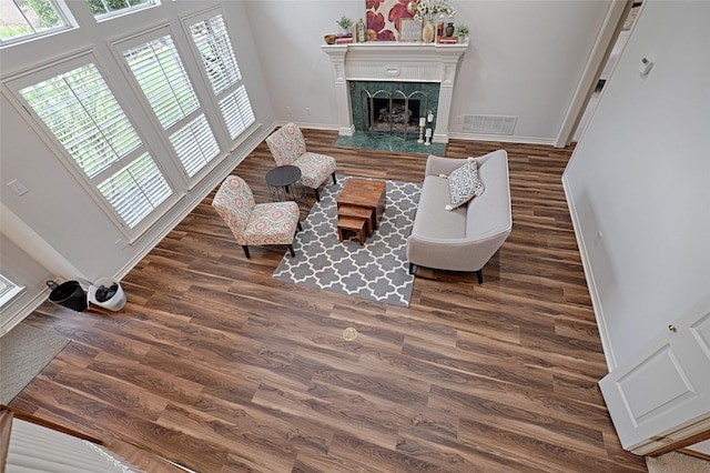2215 Burgundy Dr, Carrollton, TX 75006 - living area with visible vents, baseboards, a premium fireplace, and wood finished floors