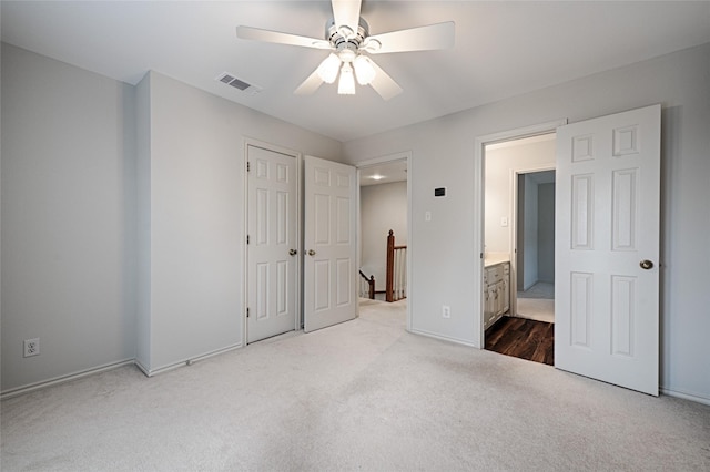 2215 Burgundy Dr, Carrollton, TX 75006 - unfurnished bedroom featuring visible vents, ceiling fan, a closet, and carpet floors
