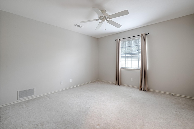 2215 Burgundy Dr, Carrollton, TX 75006 - unfurnished room with light carpet, ceiling fan, and visible vents