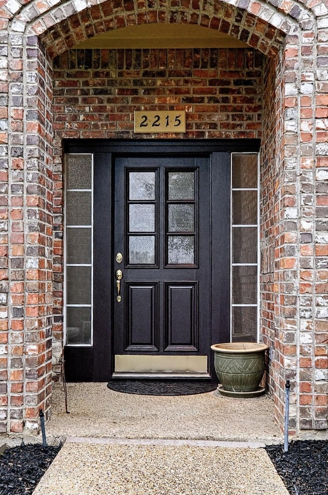 2215 Burgundy Dr, Carrollton, TX 75006 - doorway to property with brick siding