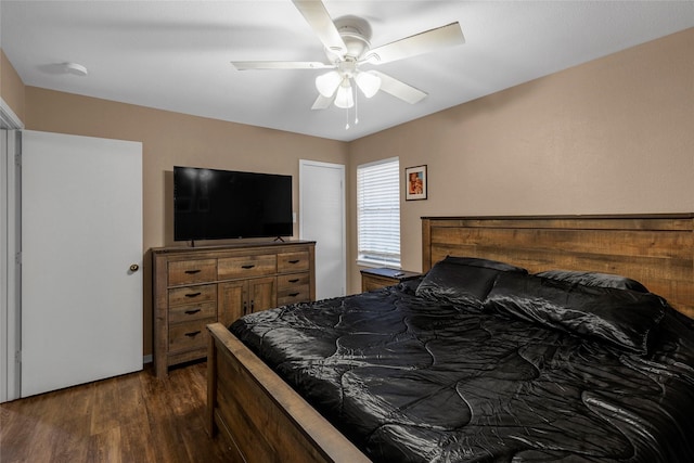 bedroom featuring dark wood-style floors and ceiling fan