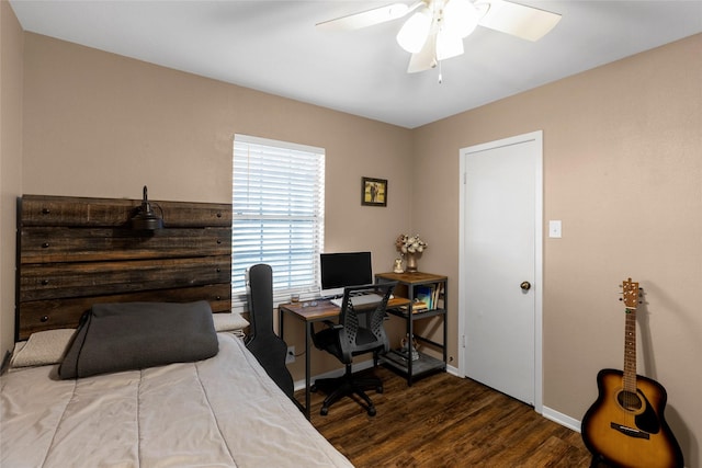 bedroom with baseboards, wood finished floors, and ceiling fan