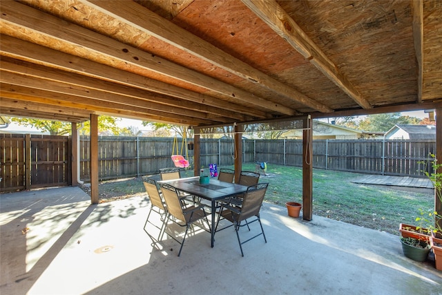 view of patio with outdoor dining area and a fenced backyard
