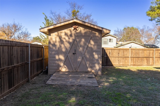 view of shed featuring a fenced backyard