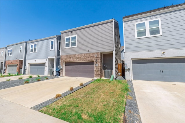 4908 Deavers Ln, Fort Worth, TX 76114 - townhome / multi-family property featuring an attached garage, concrete driveway, and brick siding