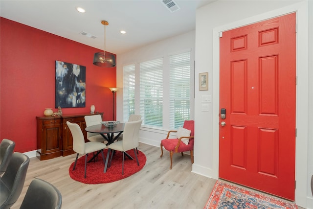 dining area with wood finished floors, baseboards, visible vents, and recessed lighting