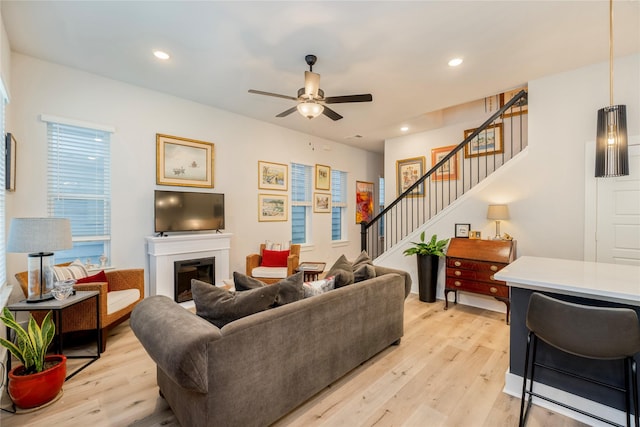 4908 Deavers Ln, Fort Worth, TX 76114 - living area featuring stairway, a ceiling fan, light wood finished floors, recessed lighting, and a fireplace
