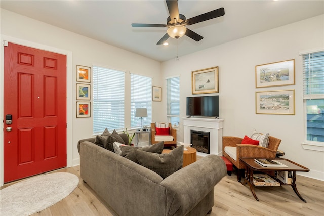 4908 Deavers Ln, Fort Worth, TX 76114 - living area with light wood-type flooring, ceiling fan, plenty of natural light, a glass covered fireplace, and recessed lighting