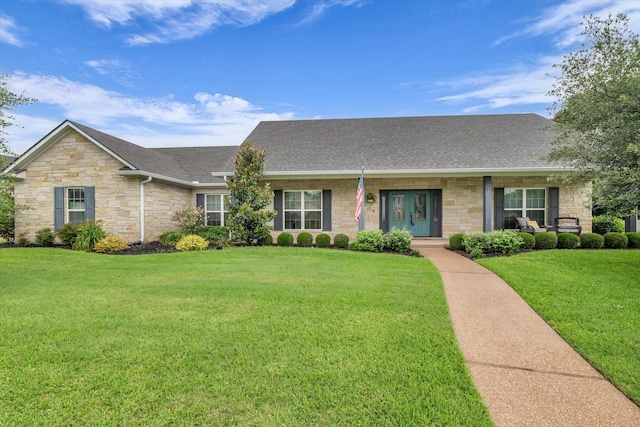 133 Creek Rdg, Waco, TX 76708 - view of front of home featuring stone siding, roof with shingles, a front yard, and covered porch
