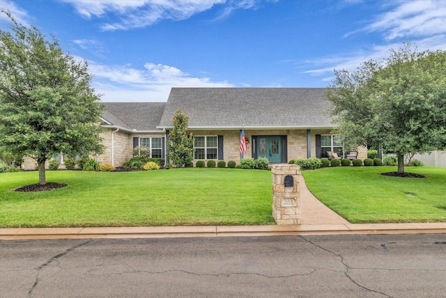 133 Creek Rdg, Waco, TX 76708 - view of front of property featuring stone siding, roof with shingles, and a front lawn
