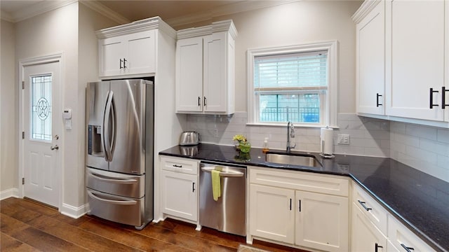 133 Creek Rdg, Waco, TX 76708 - kitchen featuring appliances with stainless steel finishes, a sink, crown molding, dark wood-type flooring, and white cabinets