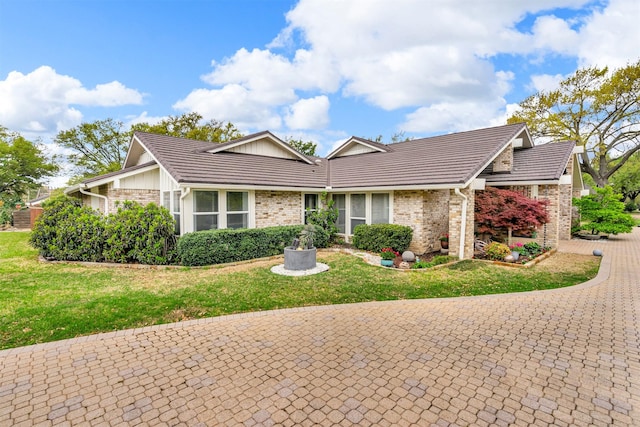 6624 Glenhurst Dr, Dallas, TX 75254 - view of front of property featuring a front yard, brick siding, and a tile roof