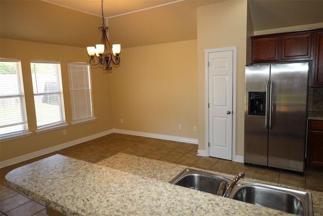 212 Telfair Ln, Bossier City, LA 71112 - kitchen featuring pendant lighting, stainless steel fridge with ice dispenser, a chandelier, a sink, and baseboards