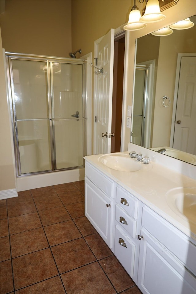 212 Telfair Ln, Bossier City, LA 71112 - bathroom with a shower stall, tile patterned floors, double vanity, and a sink