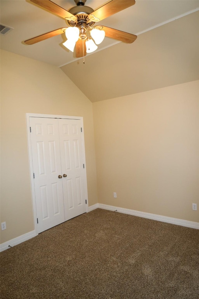 212 Telfair Ln, Bossier City, LA 71112 - unfurnished bedroom with a closet, baseboards, vaulted ceiling, visible vents, and carpet