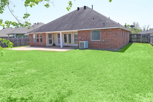 212 Telfair Ln, Bossier City, LA 71112 - back of house featuring a lawn, cooling unit, a patio, brick siding, and french doors