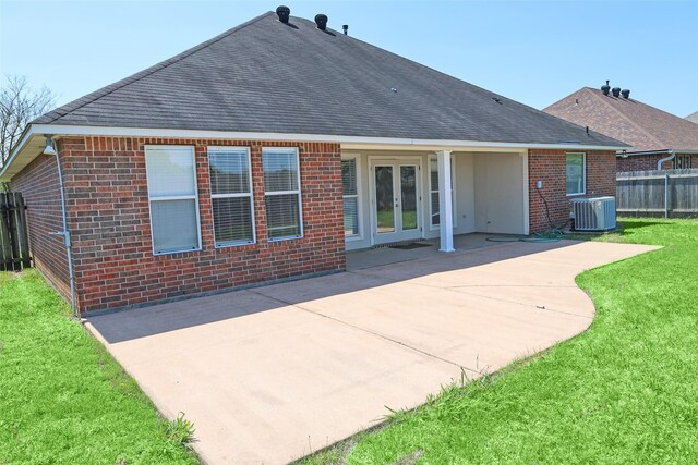 212 Telfair Ln, Bossier City, LA 71112 - back of house with a lawn, fence, central air condition unit, brick siding, and french doors