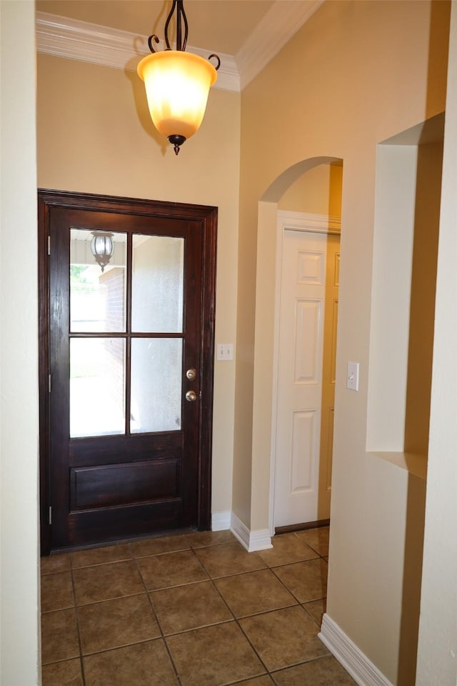 212 Telfair Ln, Bossier City, LA 71112 - entrance foyer with dark tile patterned flooring, arched walkways, baseboards, and ornamental molding