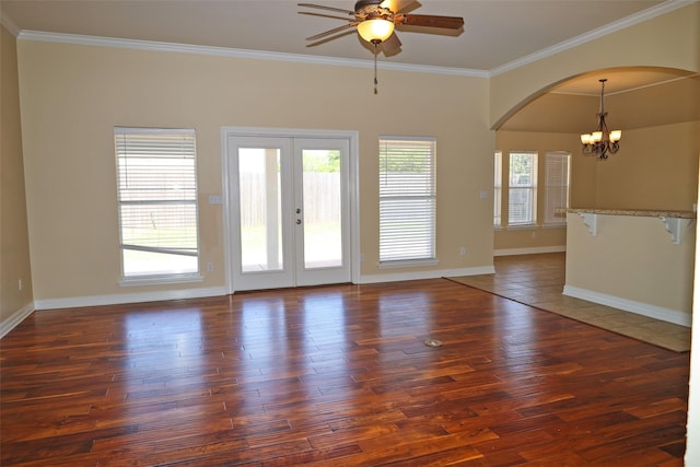 212 Telfair Ln, Bossier City, LA 71112 - unfurnished room with arched walkways, dark wood-style flooring, ceiling fan with notable chandelier, and crown molding