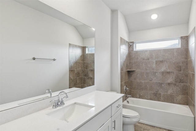full bath with shower / bathtub combination, vanity, toilet, and a wealth of natural light