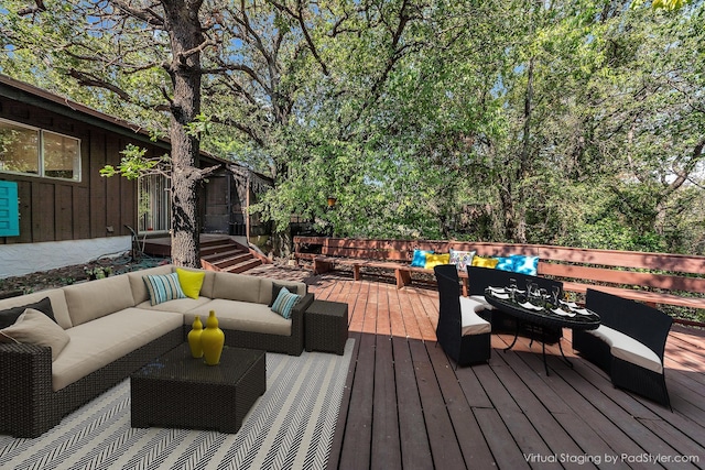 wooden deck featuring outdoor lounge area