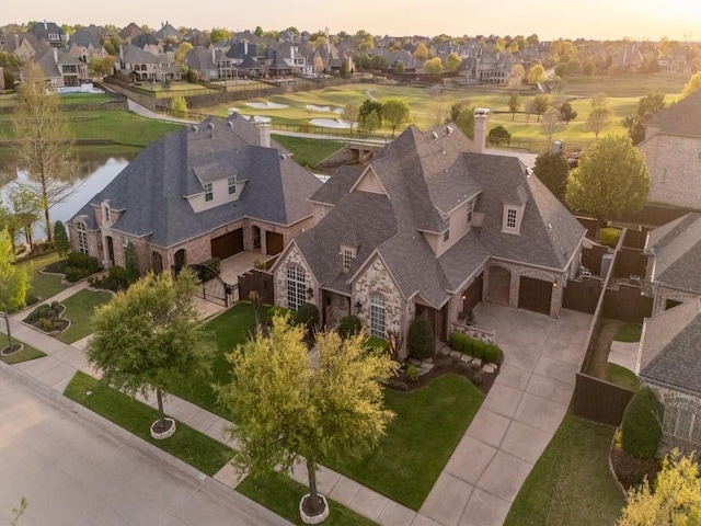 aerial view with a water view and a residential view