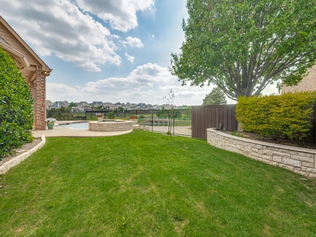 view of yard with a fenced in pool, fence private yard, and a residential view
