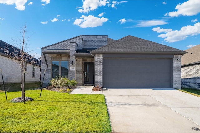 241 Little Bridge Dr, Lavon, TX 75166 - view of front of property with brick siding, an attached garage, driveway, a front lawn, and a shingled roof