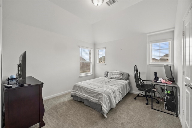 bedroom with baseboards, visible vents, lofted ceiling, and carpet floors