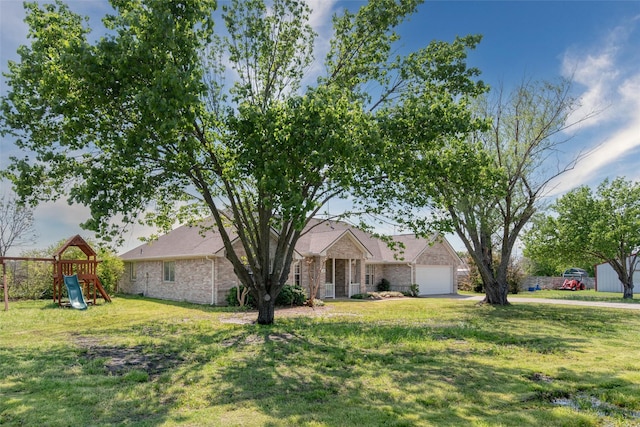 515 Meadow Dr, Lowry Crossing, TX 75069 - view of front of property with a front yard, an attached garage, and a playground
