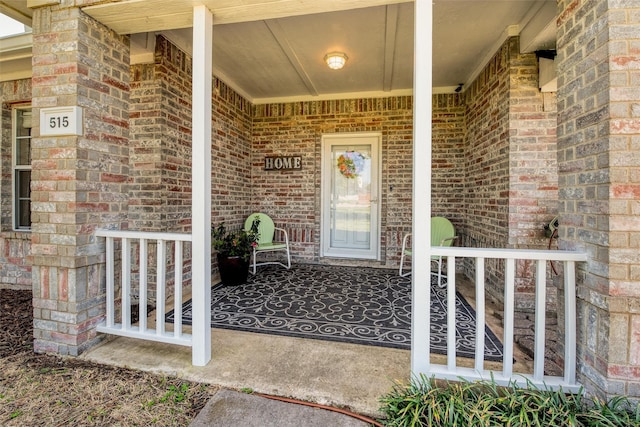 515 Meadow Dr, Lowry Crossing, TX 75069 - view of exterior entry with a porch and brick siding