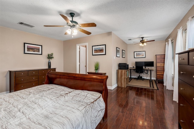 515 Meadow Dr, Lowry Crossing, TX 75069 - bedroom with an office area, dark wood-type flooring, baseboards, a textured ceiling, and ceiling fan