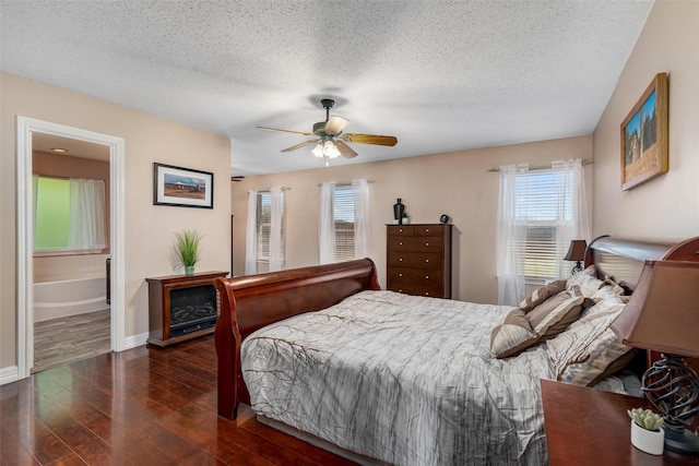 515 Meadow Dr, Lowry Crossing, TX 75069 - bedroom with multiple windows, wood finished floors, a textured ceiling, baseboards, and a ceiling fan