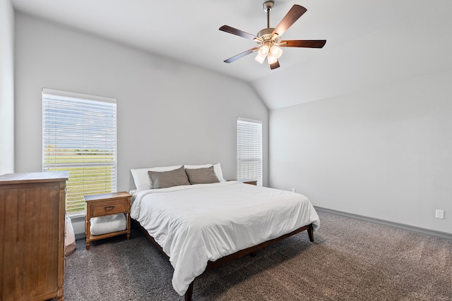 carpeted bedroom featuring lofted ceiling and a ceiling fan