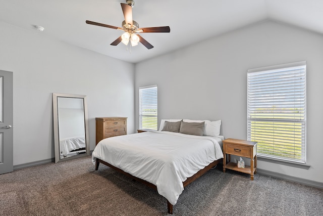 carpeted bedroom featuring baseboards, vaulted ceiling, and ceiling fan