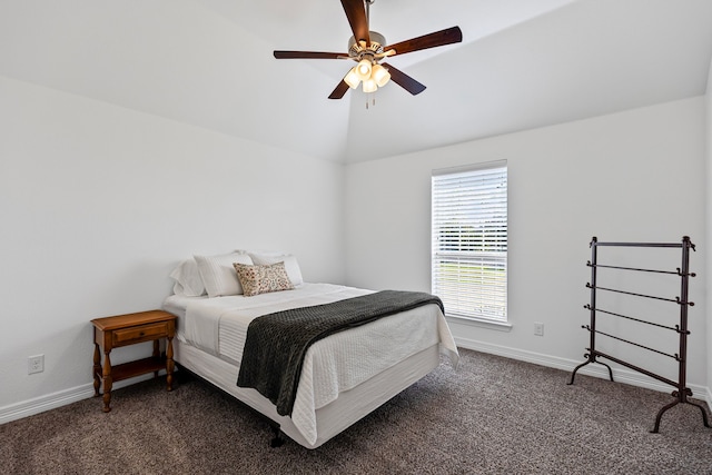bedroom with baseboards, vaulted ceiling, and carpet
