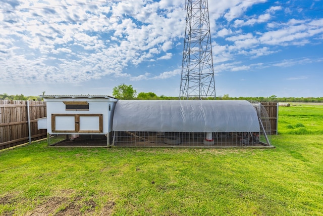 exterior space with an outdoor structure, exterior structure, and fence