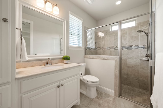 full bath featuring vanity, recessed lighting, a stall shower, and toilet