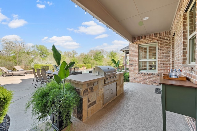 view of patio / terrace featuring exterior kitchen and area for grilling