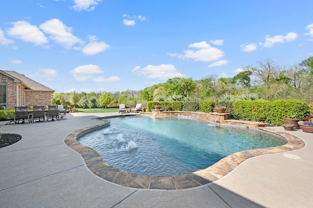 outdoor pool with a patio and outdoor dining space