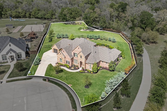 drone / aerial view with a view of trees