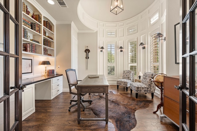 office space with ornamental molding, dark wood-style flooring, and visible vents