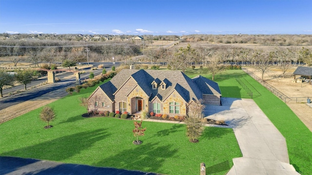 4994 Dogwood Dr, Celina, TX 75009 - view of front of house featuring stone siding and a front lawn
