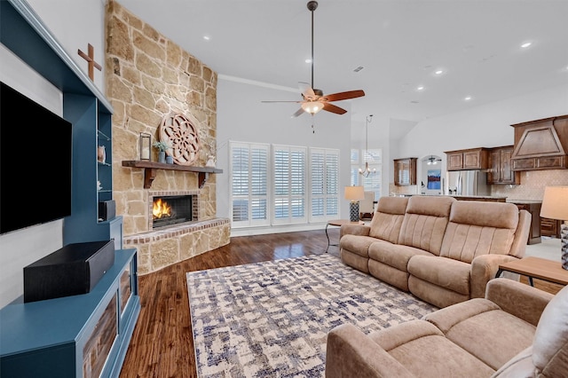 4994 Dogwood Dr, Celina, TX 75009 - living room with ceiling fan, a towering ceiling, a stone fireplace, recessed lighting, and dark wood-style floors