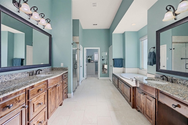 4994 Dogwood Dr, Celina, TX 75009 - bathroom featuring a shower stall, vanity, a bath, and tile patterned flooring