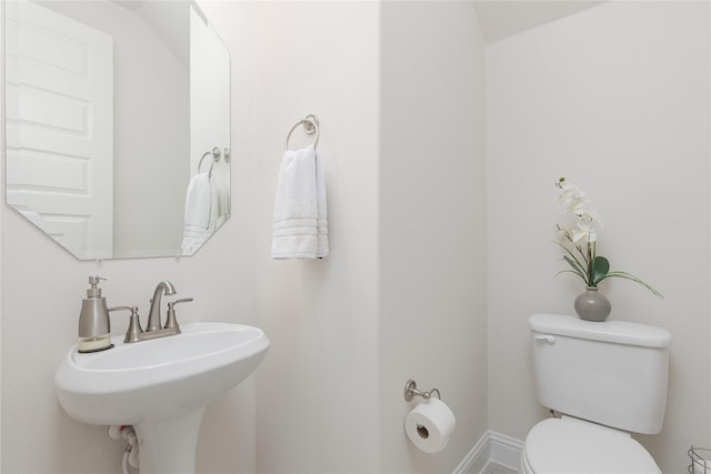 564 Embargo Dr, Fate, TX 75189 - half bathroom with toilet and a sink