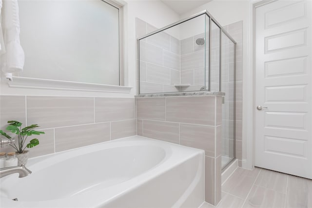 564 Embargo Dr, Fate, TX 75189 - bathroom with a bath and a stall shower