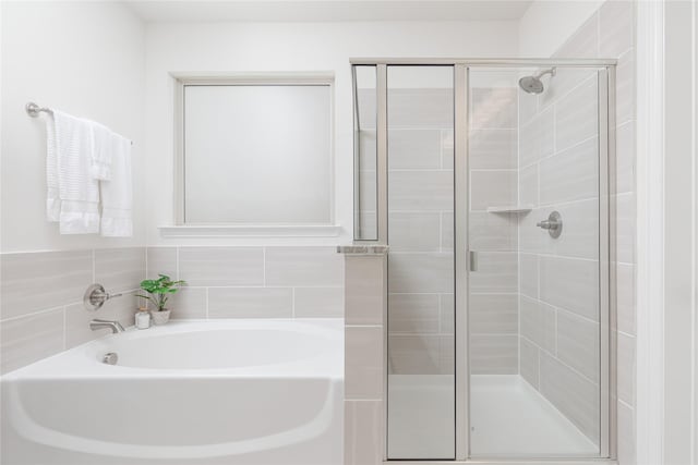 564 Embargo Dr, Fate, TX 75189 - full bath with a bath and a stall shower